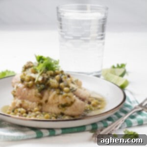 Romantik Akşamların Yıldızı: Yeşil Soslu Berlam 10 Hake in Green Sauce plated with glass of water