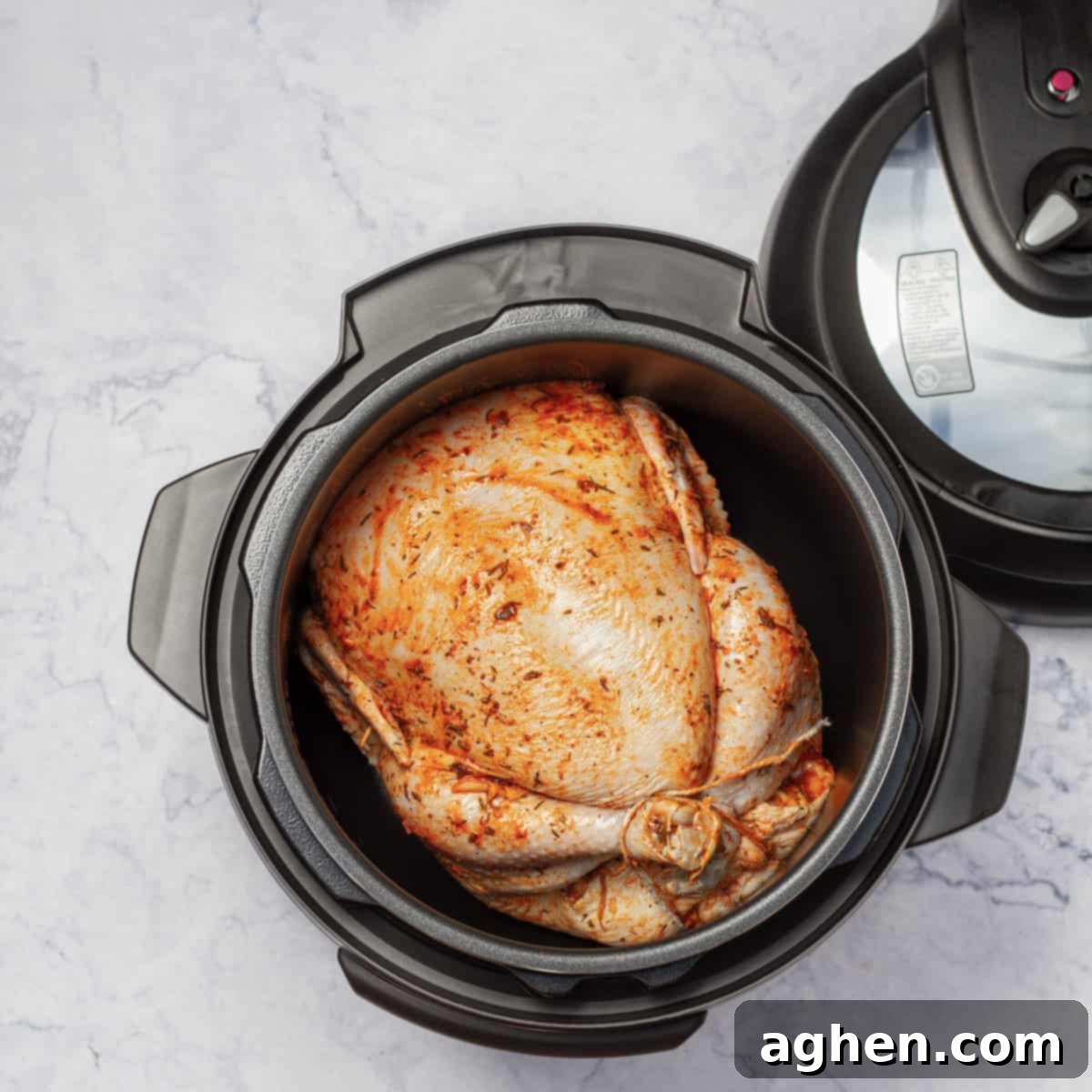 Instant Pot Whole Chicken placed on a trivet inside the Instant Pot