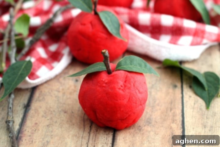 A non-toxic, taste-safe, apple scented playdough recipe perfect for Fall sensory play at home or in the classroom. Takes only 10 minutes to make!