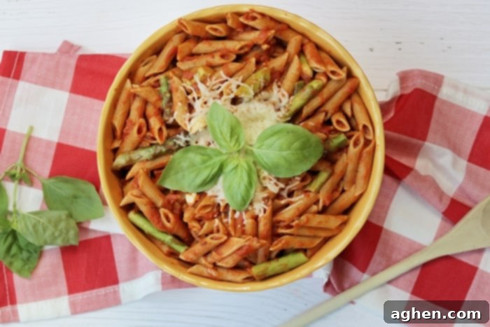 Whole wheat pasta with asparagus and marinara sauce is a quick and easy weeknight dinner option that the whole family will enjoy.