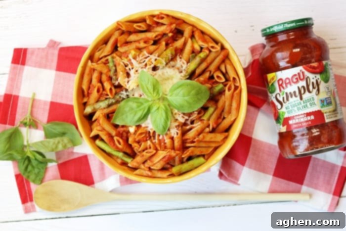 Whole wheat penne with asparagus and RAGÚ® Simply Chunky Marinara Pasta Sauce for a healthy, quick weeknight dinner.