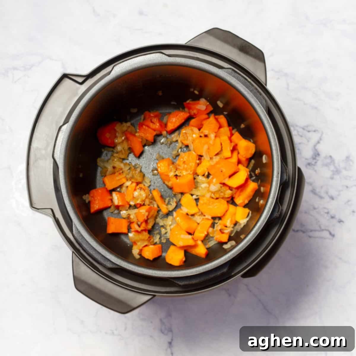 Onion, garlic, carrots, and celery sautéing in the Instant Pot, forming the aromatic base for Split Pea Soup.