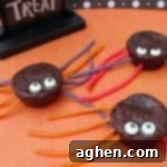 Spider brownie treats made with brownie bites, candy eyeballs, and licorice ropes.