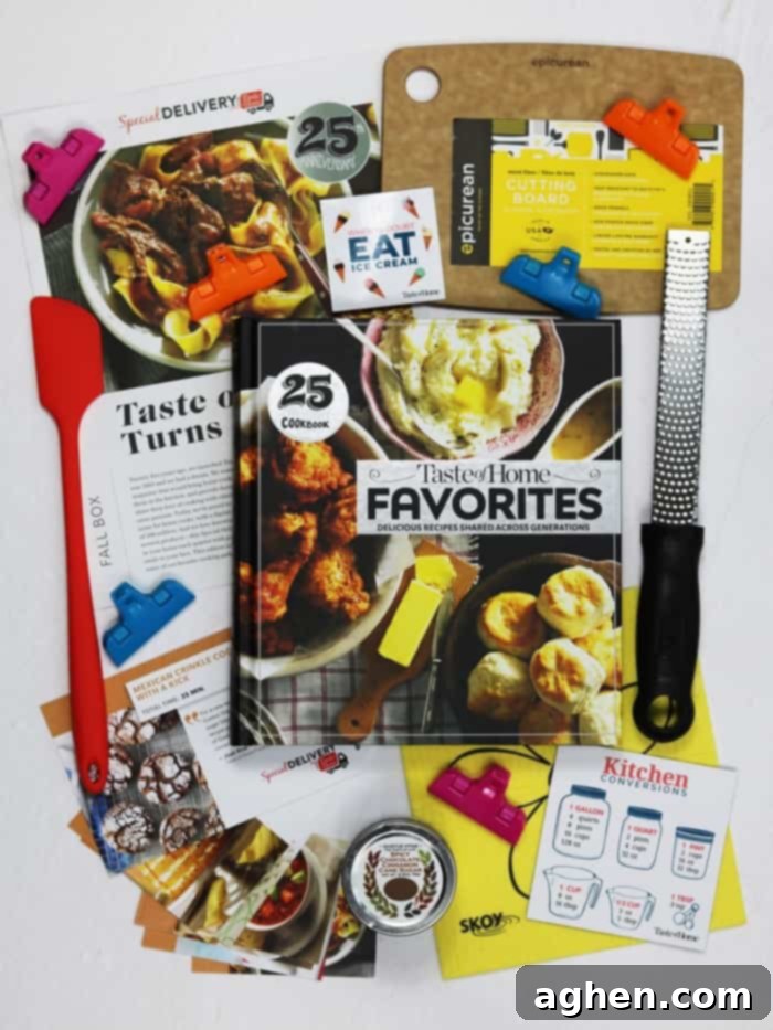 A detailed view of the contents of the Taste of Home Special Delivery Fall 2018 Subscription Box, showcasing various cooking tools and gourmet ingredients.