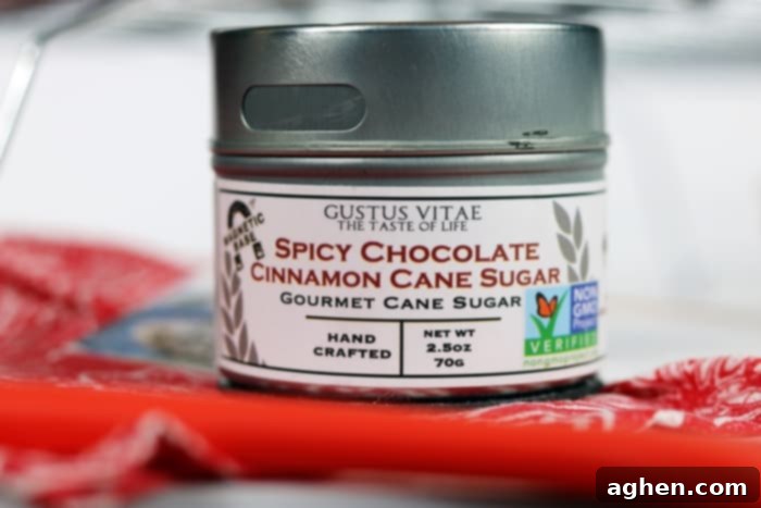 A close-up of the Gustus Vitae spicy chocolate cinnamon cane sugar jar, highlighting its intriguing spice blend for baking.