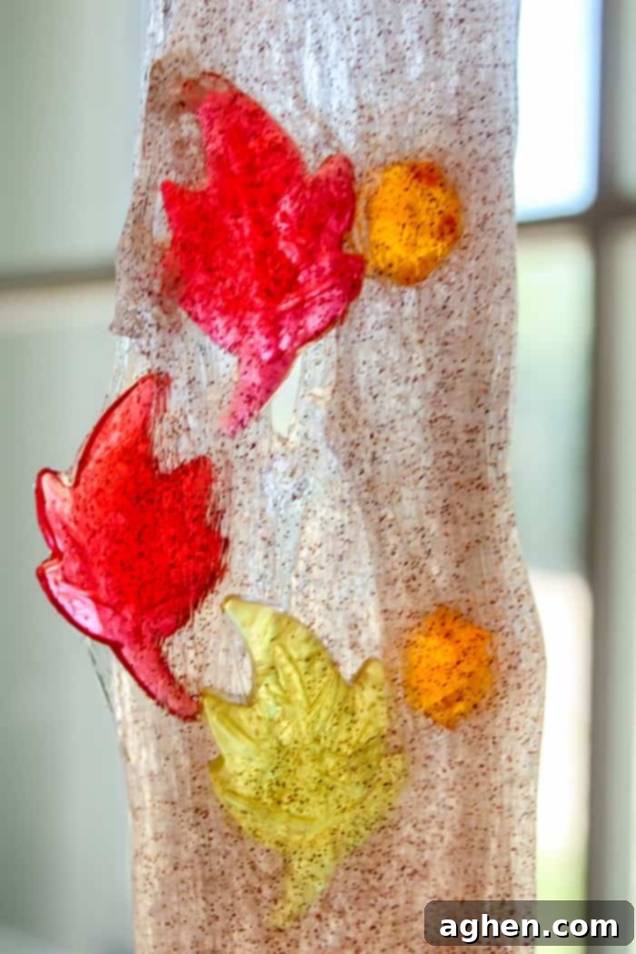 Close-up of cinnamon-scented glitter fall slime, highlighting its borax-free composition and suitability for preschool science and sensory play.