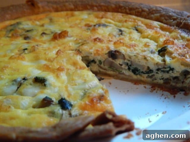 asiago spinach quiche in white dish