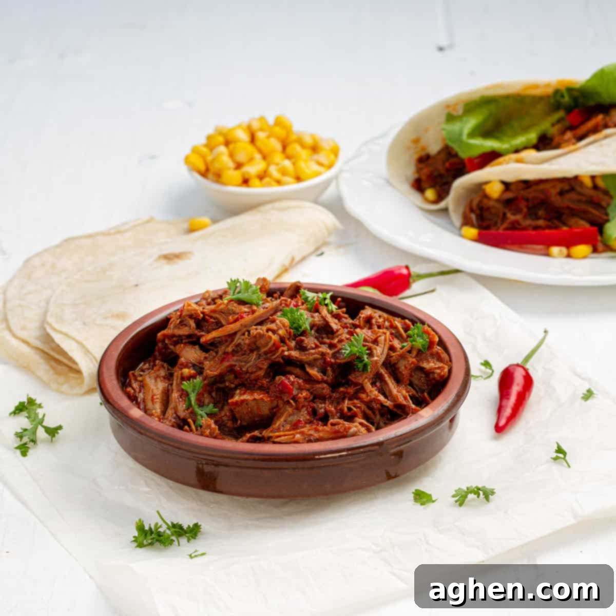 Easy Instant Pot Birria 2 Instant Pot Birria served with chilies and tortillas