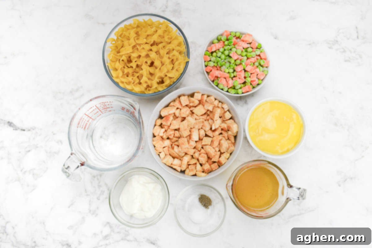 Heartwarming Chicken Noodle Bake 3 Bowls of the ingredients for weight watchers chicken noodle casserole are shown