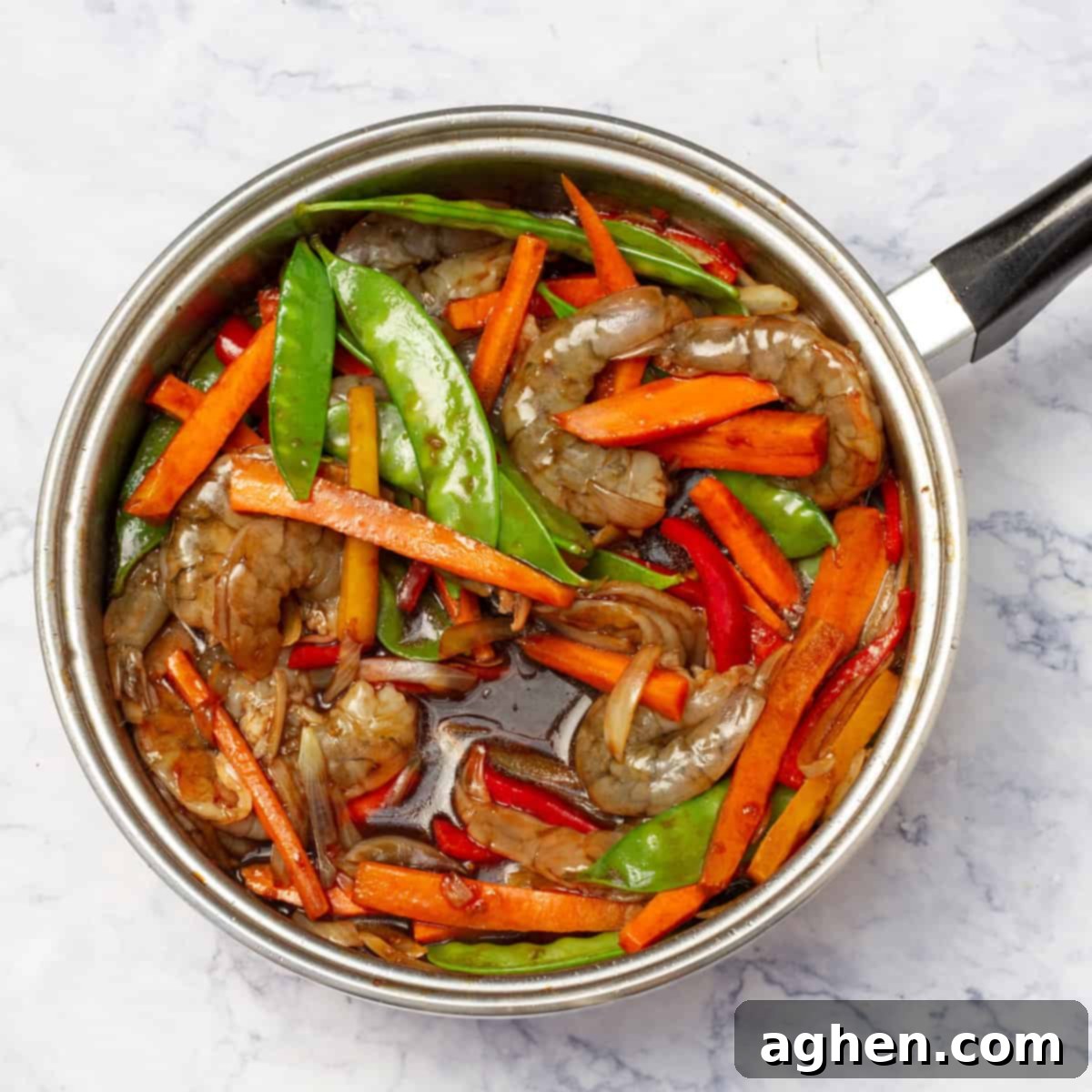 Shrimp Stir Fry in a wok, perfectly coated with a thick sauce