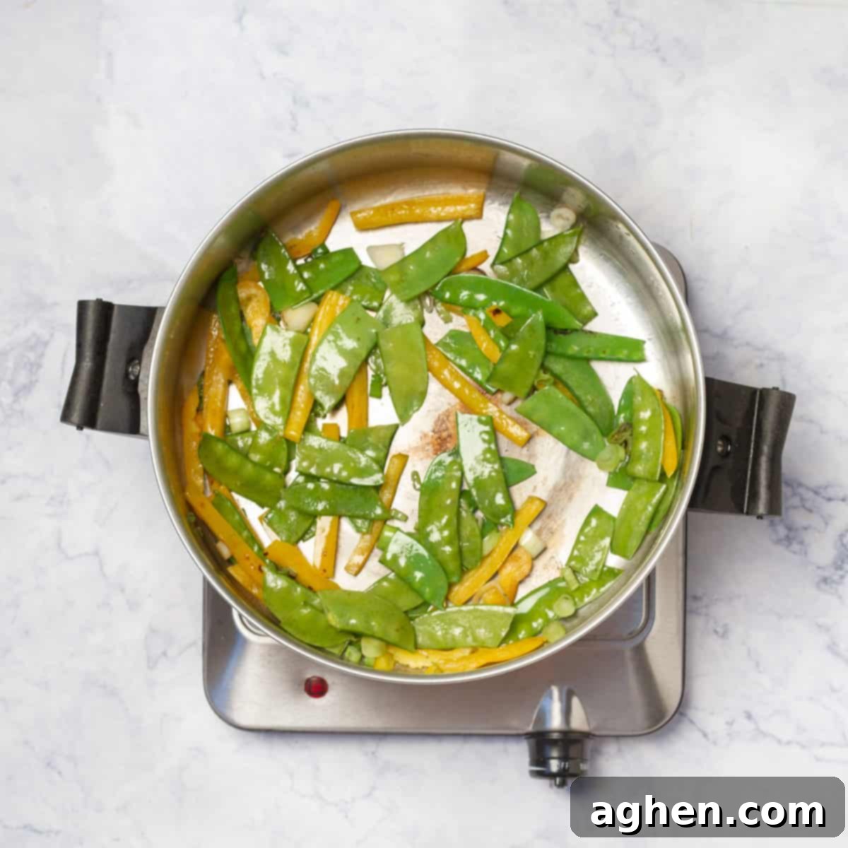 Dangerously Delicious Weight Watchers Thai Noodles 6 Carrots, green onions, and yellow bell pepper stir-frying in a hot skillet