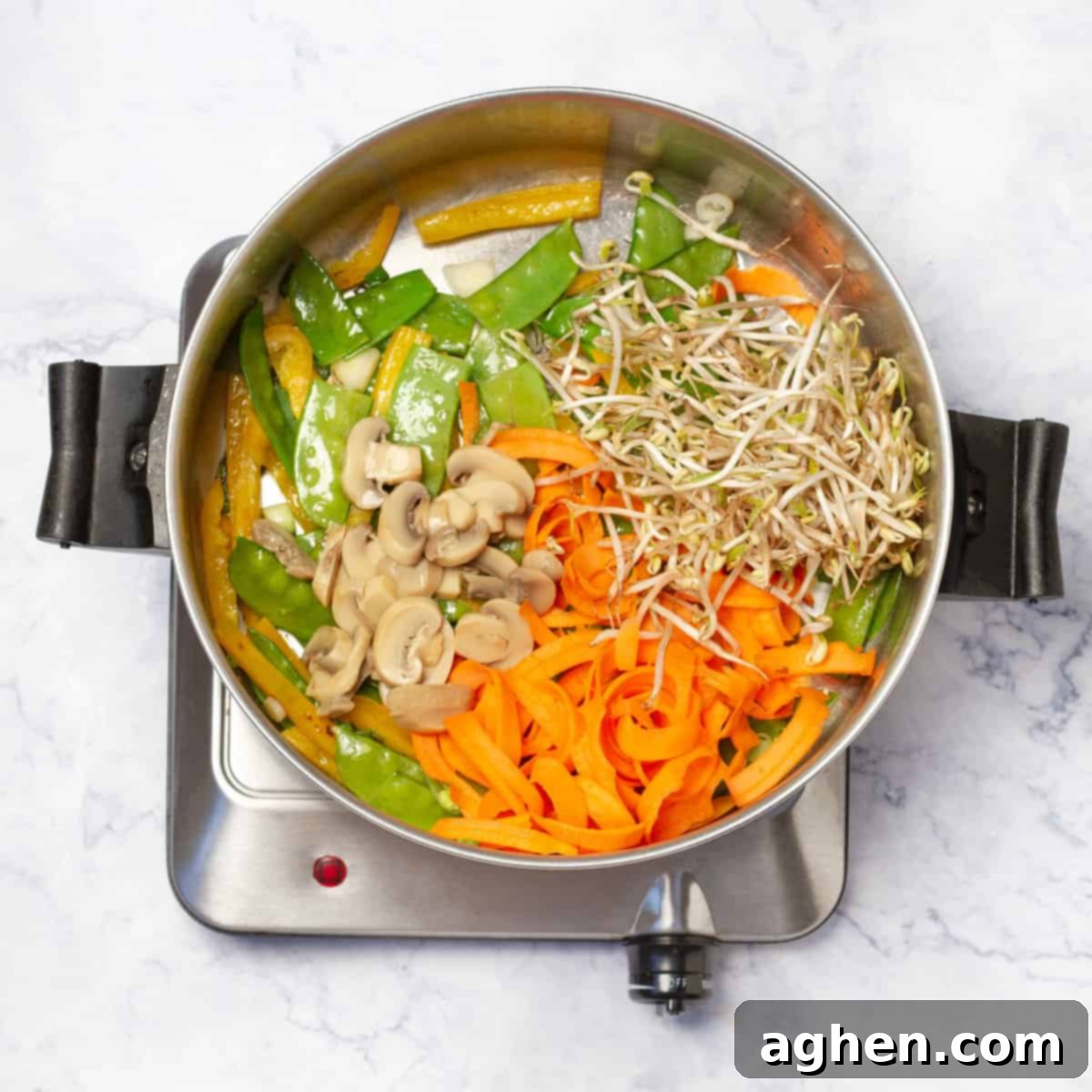 Dangerously Delicious Weight Watchers Thai Noodles 7 Mushrooms, snow peas, and bean sprouts being added to the stir-frying vegetables