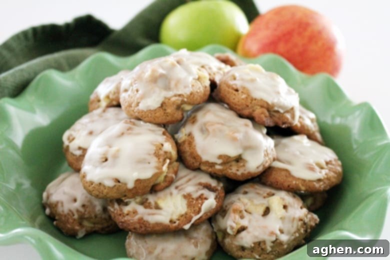 These soft apple cookies combine tender pieces of apple, crunchy bits of toasted pecans, and a sweet glaze for a completely irresistible Fall dessert. 