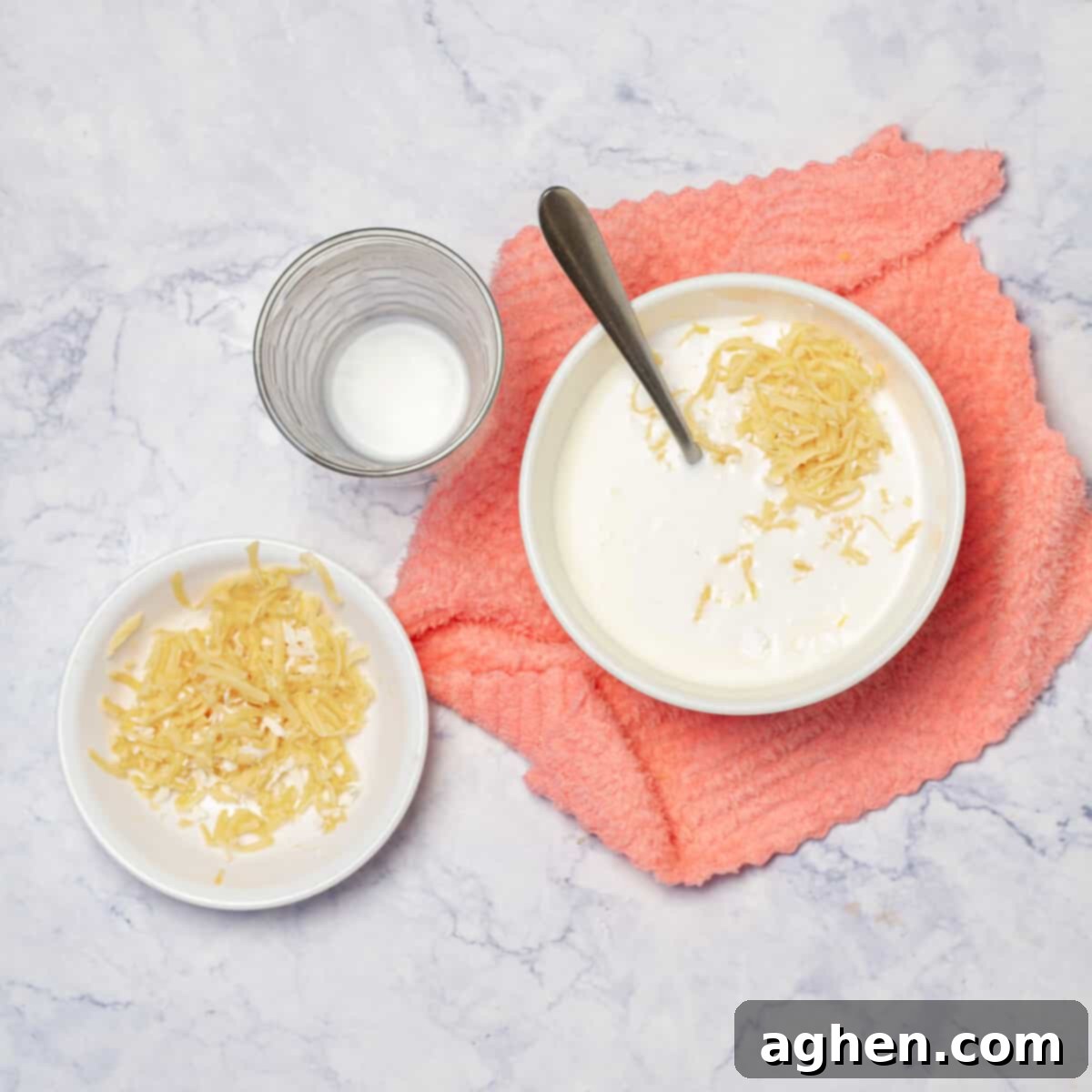 Skinny Chicken Divan Perfection 4 A bowl of cornstarch, shredded mozzarella and milk, ingredients for making the creamy sauce.