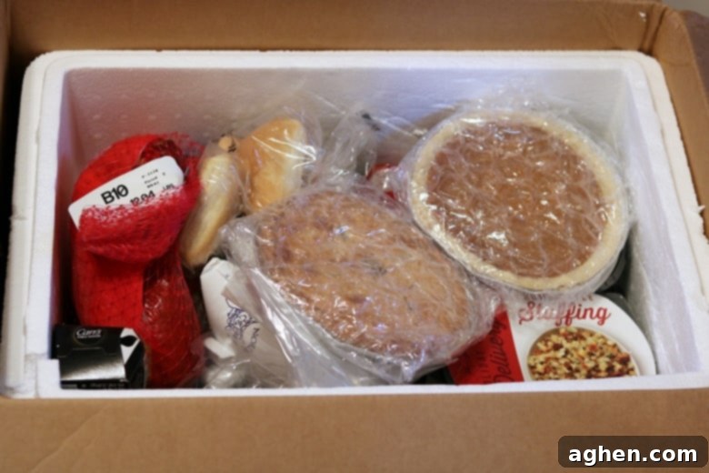 Unboxing the Boston Market Thanksgiving home delivery meal, packed safely in a cooler.