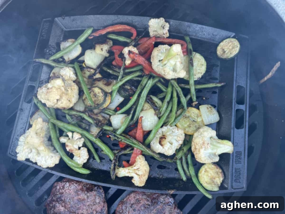 20 Sizzling Tips for Winter Grilling 3 Veggies grilling next to two meat patties