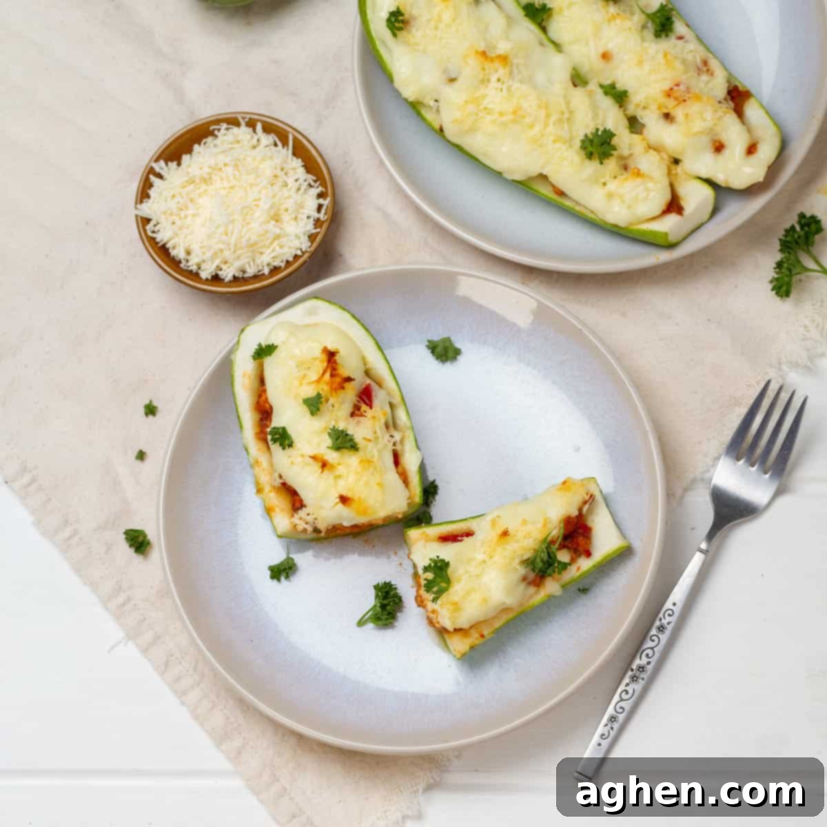 Zucchini Boats served in plates with sppon