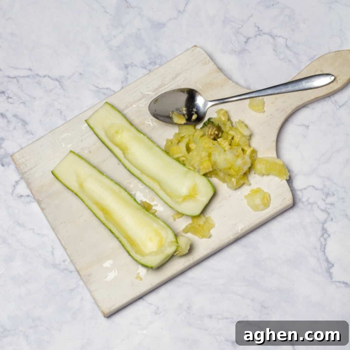 scoop out the seeds and interior of the zucchinis with a spoon