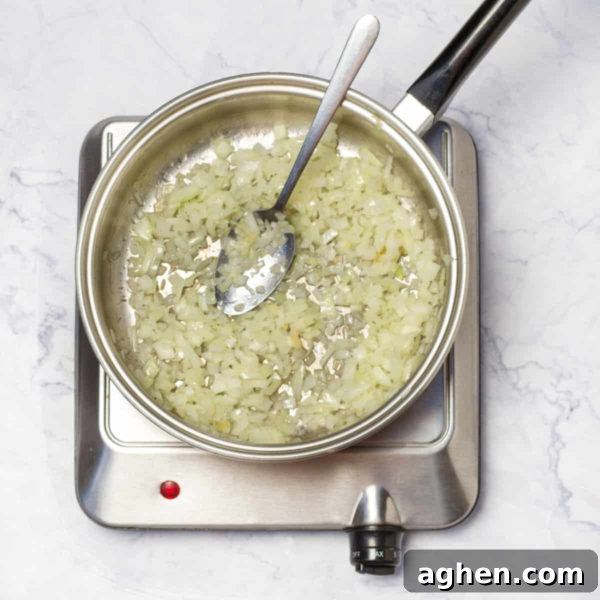In a skillet diced onions and minced garlic, sautéing until translucent