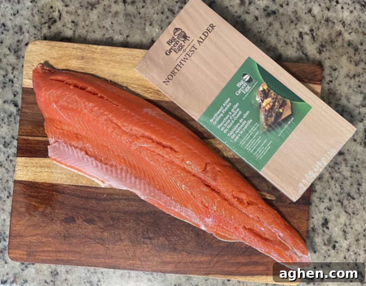 raw salmon sitting on a cutting board