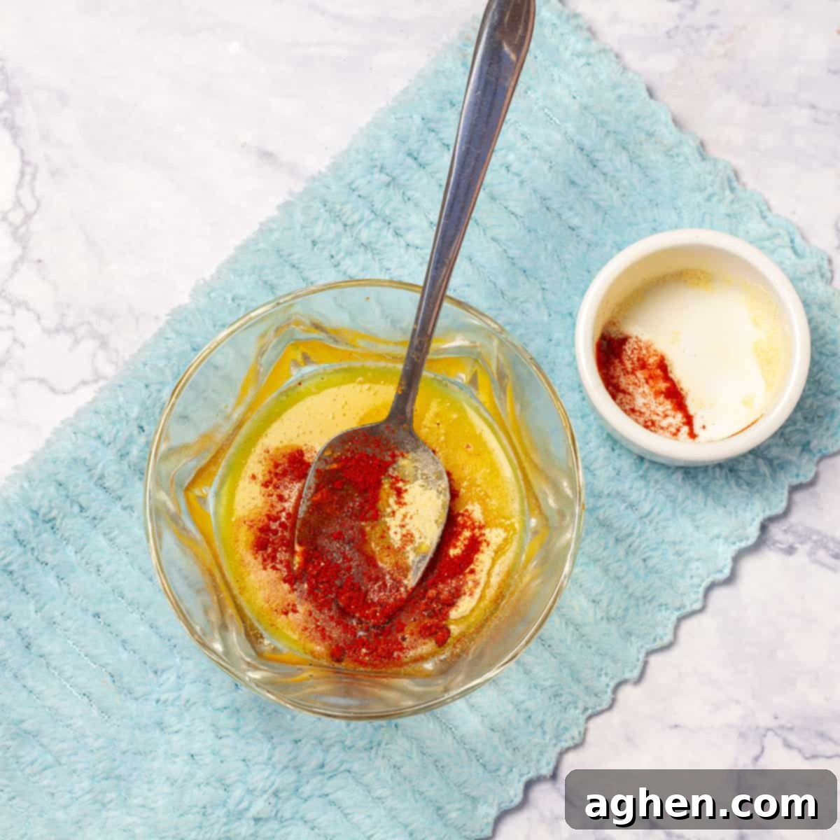Make the butter sauce by melting butter with olive oil, paprika, and red pepper flakes (if using) in a small saucepan.