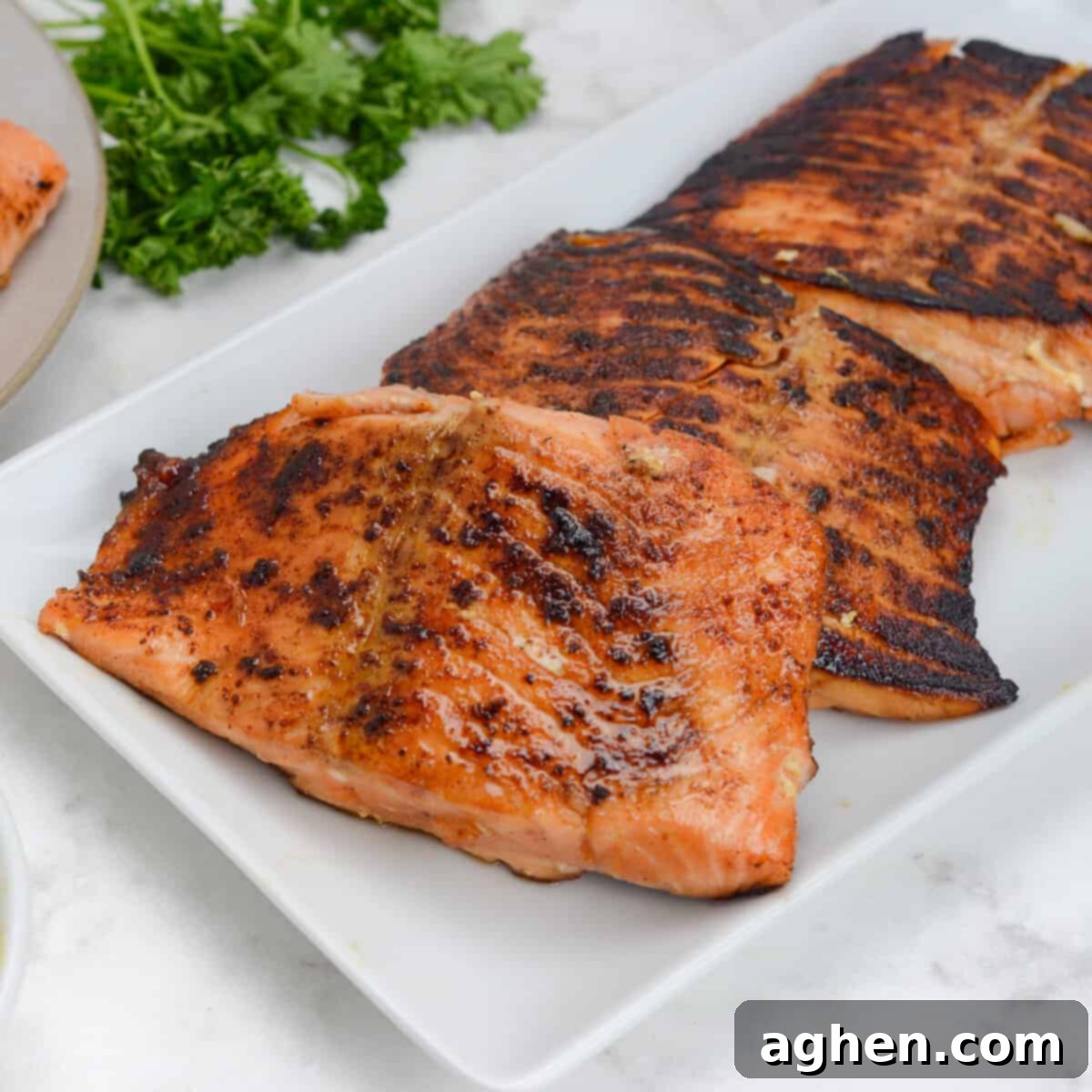 finished blackstone salmon, plated on a white platter