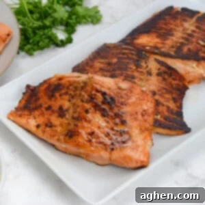 blackstone salmon sitting on a white plate.