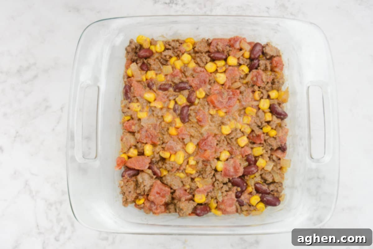 Guilt-Free Cowboy Casserole: A Weight Watchers Recipe You'll Love 9 A square casserole dish filled with the Cowboy casserole filling is shown.