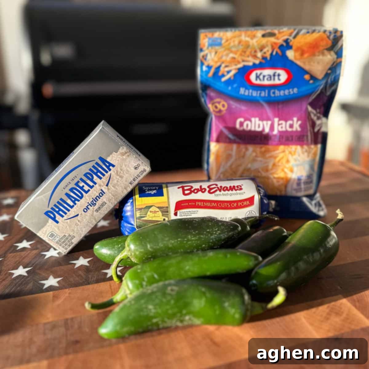 Ingredients for Traeger jalapeno poppers including jalapenos, sausage, cream cheese, and spices