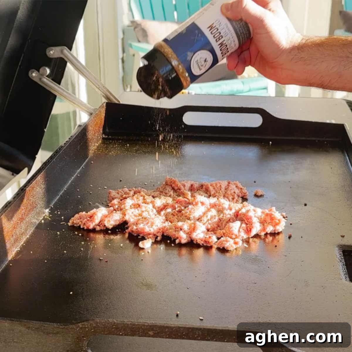 Cooked ground sausage cooling down in a pan on a Traeger Flatrock