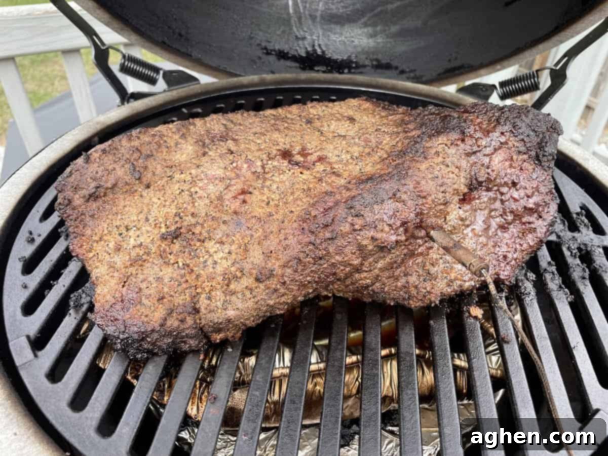 Aaron Franklin's Brisket: Can My Big Green Egg Handle It? 7 Brisket developing a dark bark on the smoker