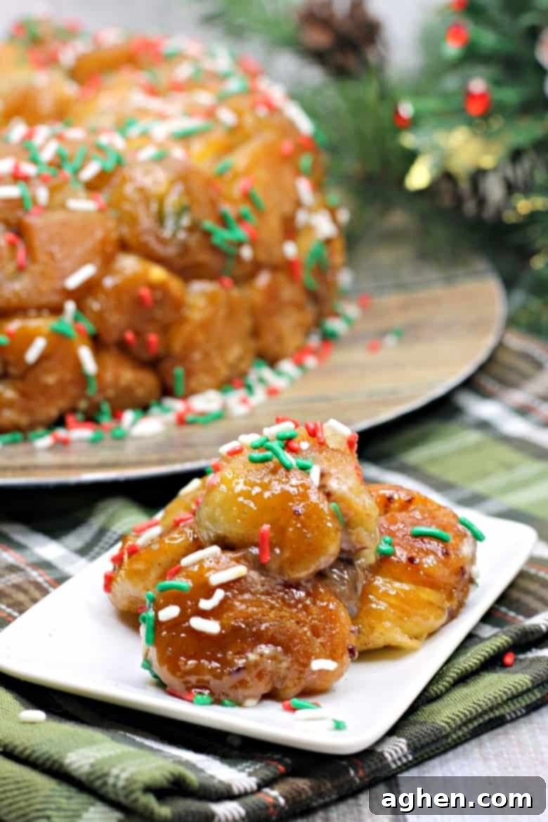 Made using refrigerated biscuit dough, stuffed with chocolate, and covered in holiday sprinkles, this easy chocolate-stuffed monkey bread recipe is a perfect treat for Christmas morning breakfast.