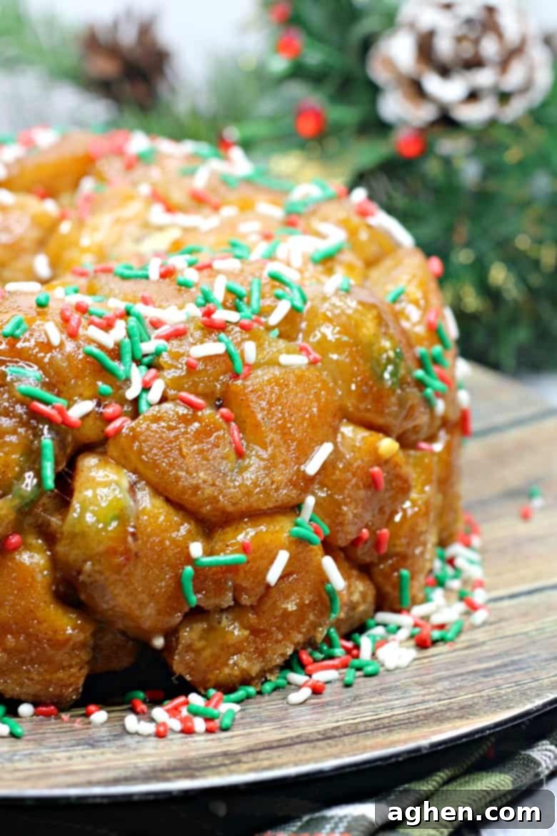 Christmas Monkey Bread made easy with refrigerated biscuit dough, stuffed with chocolate, and covered in festive holiday sprinkles. A delightful breakfast or dessert.