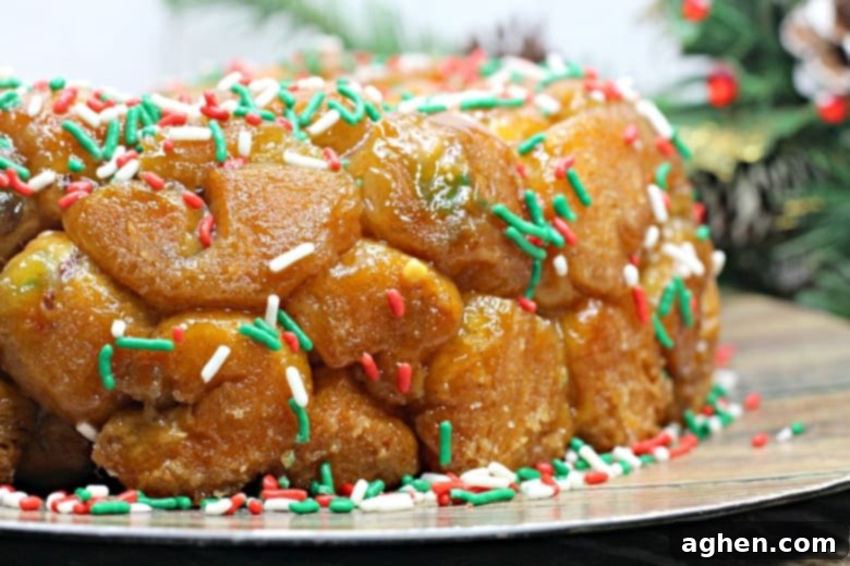 Finished Chocolate-Stuffed Christmas Monkey Bread served on a festive platter and generously covered in holiday sprinkles, a perfect sweet treat.