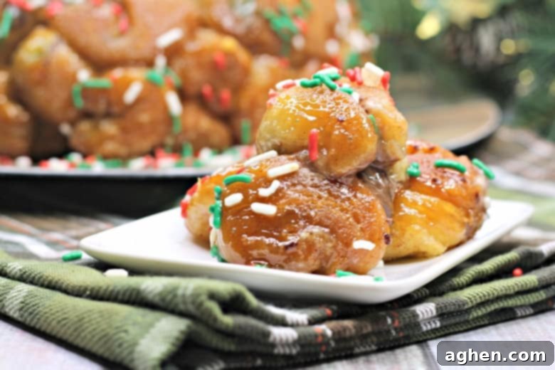 Easy Christmas Monkey Bread made with refrigerated biscuit dough, stuffed with rich chocolate, and generously covered in festive holiday sprinkles. The perfect Christmas dessert or breakfast treat.