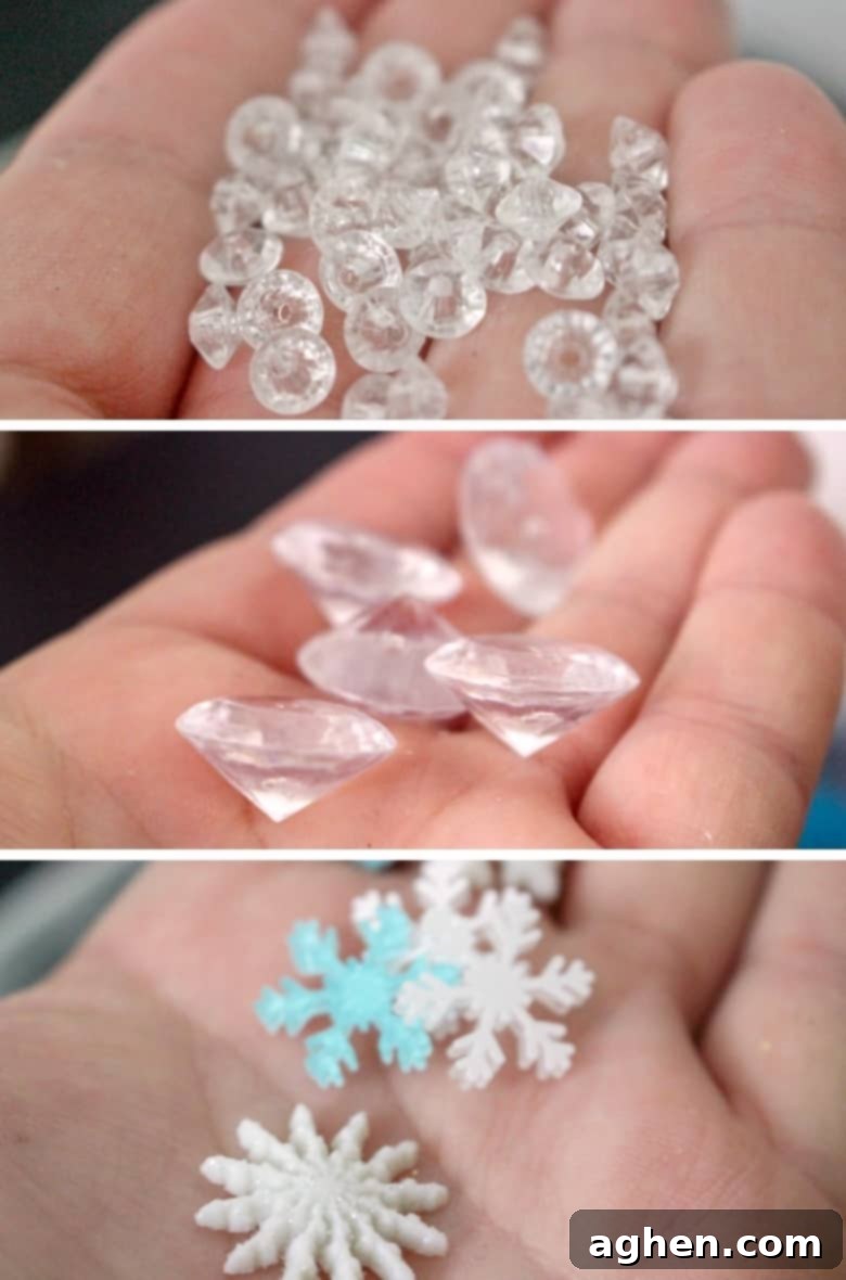 A collection of Frozen slime mix-ins including snowflake and diamond beads, blue sequins, and faux snow