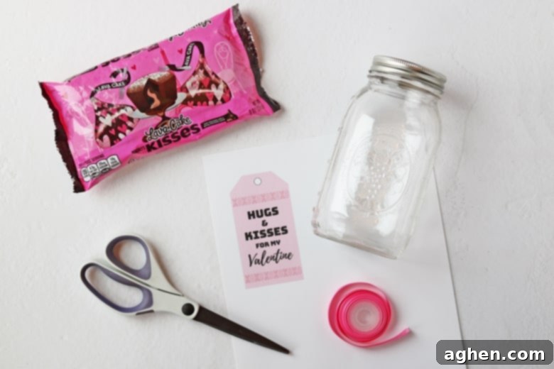 An easy mason jar Hershey Kisses Valentine gift tutorial, complete with a printable "hugs and kisses for my Valentine" label.