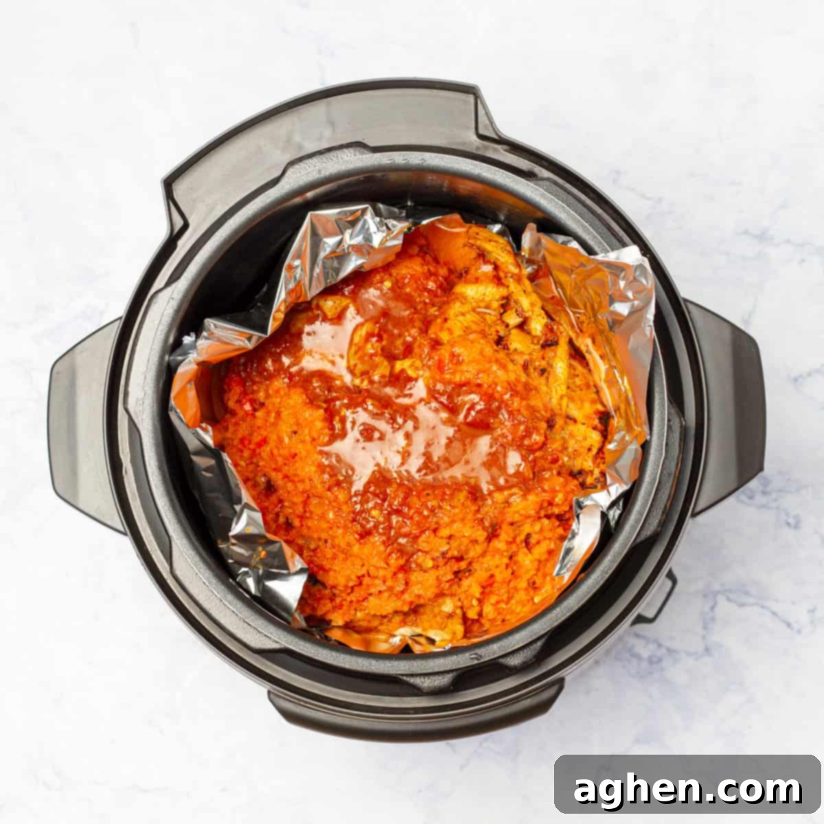 sautéed chicken breast fillets on the foil placed in instant pot