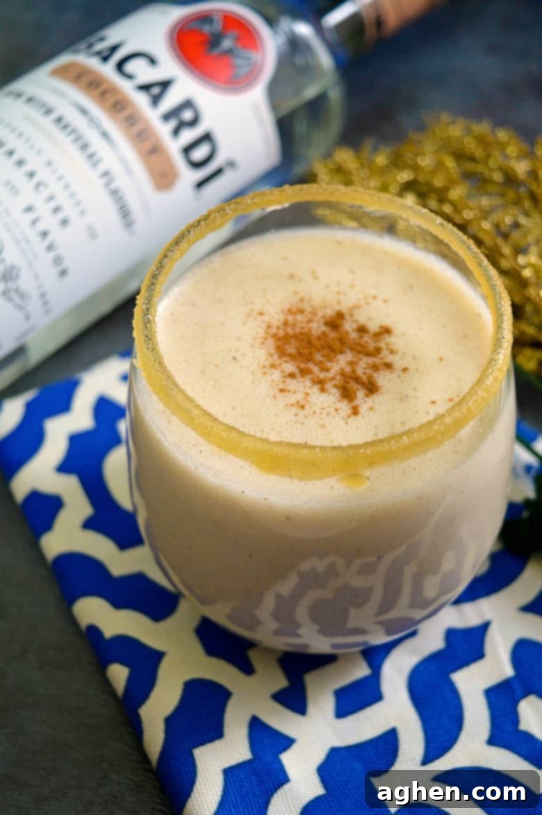 A rich and creamy, no-egg, coquito recipe made with Bacardi rum and coconut milk, ready for serving.