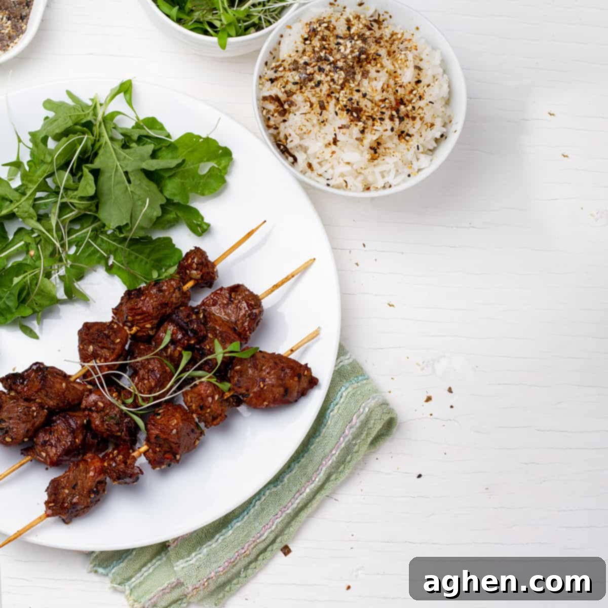 Green Tea Beef Kebabs plated with green salads