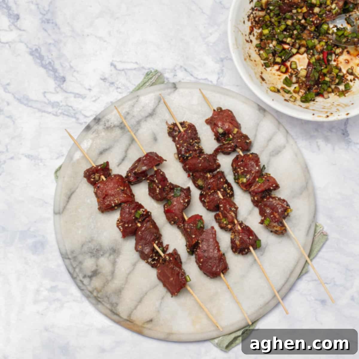 marinated beef cubes thread onto skewers 