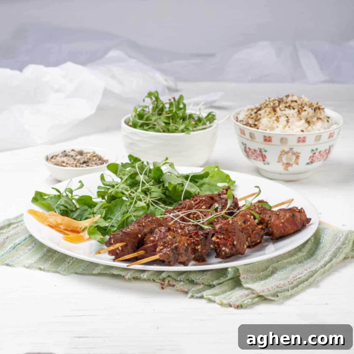 Green Tea Beef Kebabs plated with green salads