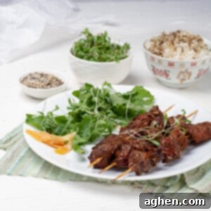 Green Tea Beef Kebabs plated with green salads