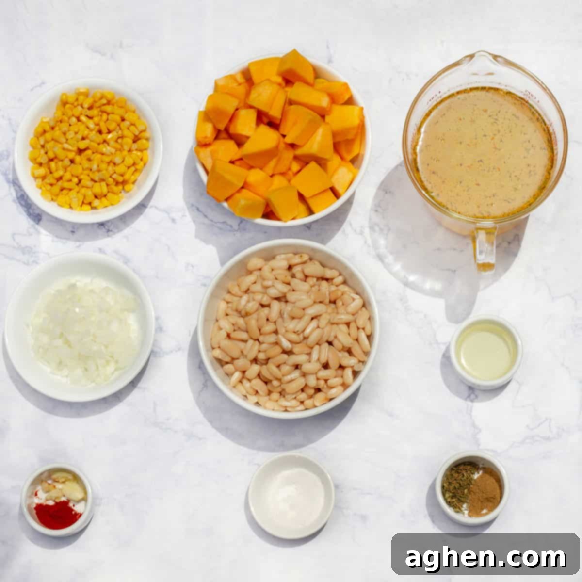 Guilt-Free Delicious Porotos Granados Soup Only 1 Weight Watchers Point 3 Arrangement of fresh ingredients for Porotos Granados Soup, including navy beans, corn, pumpkin, onions, and spices.