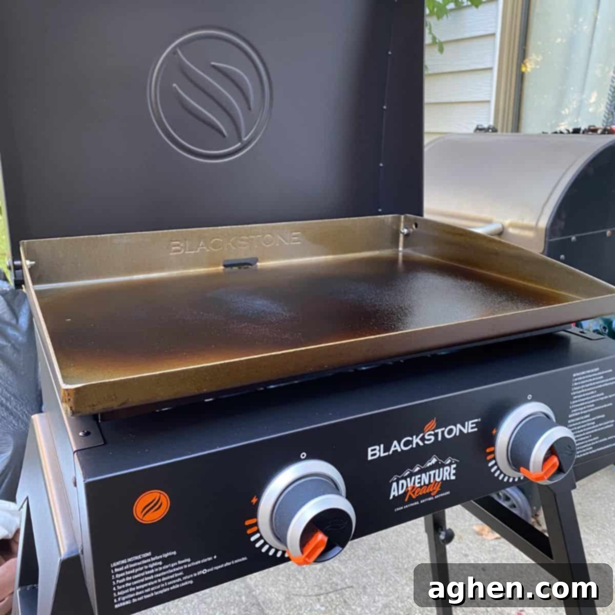 From Novice to Griddle Guru: 10 Hard-Earned Lessons After 3 Years on the Blackstone 2 Blackstone grill sits on patio with the lid open, ready for cooking.