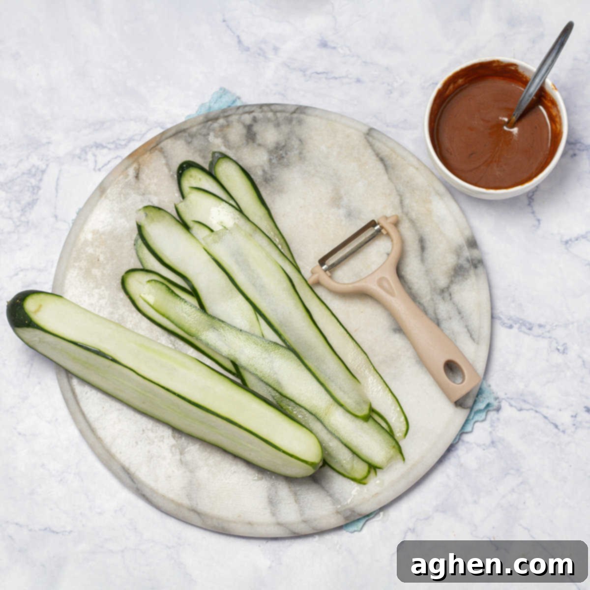 slice the cucumber into thin ribbons using a vegetable peeler