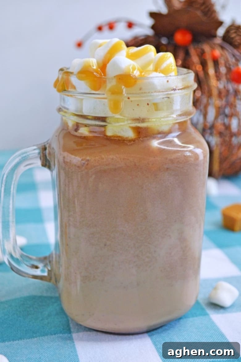 A rich and creamy slow cooker salted caramel hot chocolate recipe that will warm up your bones on those chilly Winter nights.