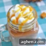 A rich and creamy salted caramel hot chocolate recipe that you can make easily right at home in your slow cooker.
