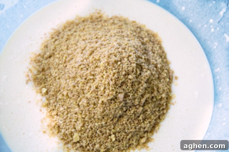 In progress image of dry ingredients being added to wet ingredients
