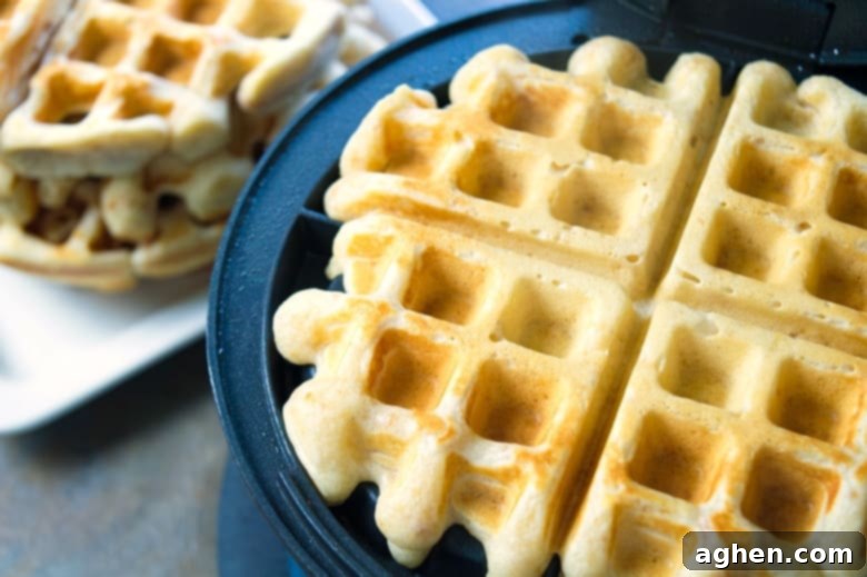 Reese's waffles in waffle iron, cooked to a golden color